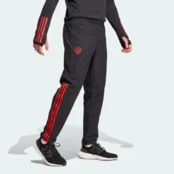Pantalon De SurvĂȘtement Manchester United 2023/2024 - Noir/Rouge